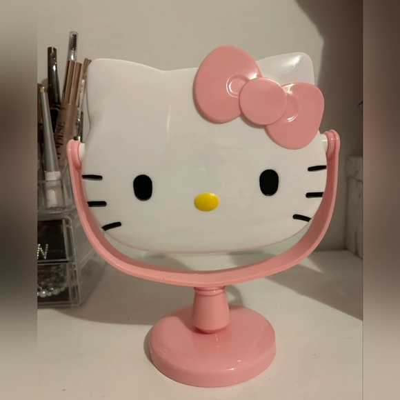 New Hello Kitty pink rotating makeup mirror approximately 8" tall. RED A… - Picture 3 of 5